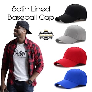 May include: Four baseball caps in different colors: black, gray, red, and blue. The caps have a curved brim and are made of a soft, comfortable fabric. The caps are lined with satin.