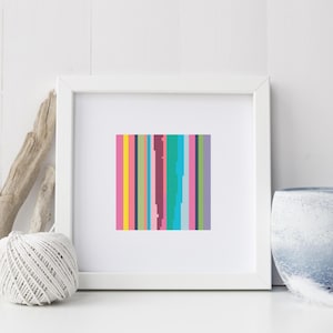 May include: A framed print of a colorful abstract design with vertical stripes in shades of pink, yellow, blue, green, and purple.
