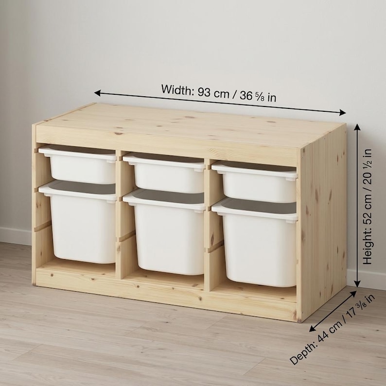 May include: A light-colored wooden storage unit with six white storage bins. The unit is 36 5/8 inches wide, 20 1/2 inches high, and 17 3/8 inches deep. Ideal for organizing toys or other items.