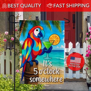 May include: A rectangular garden flag featuring a colorful macaw perched on a wooden post against a tropical beach background. The parrot holds a green cocktail with an orange slice. The text reads, It's 5 o'clock somewhere, in white letters.