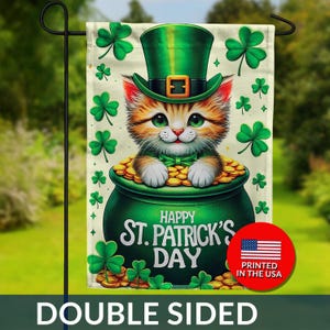 May include: Double-sided garden flag featuring a cute kitten wearing a green leprechaun hat and bow tie, sitting in a pot of gold. The flag has the text "Happy St. Patrick's Day" and shamrocks.