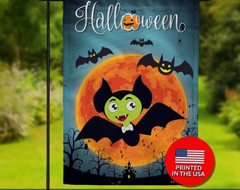 May include: Double-sided Halloween garden flag featuring a cartoon bat with a green face, black wings, and a white bow tie. The flag has a full orange moon, bats, and the word "Halloween". Printed in the USA.
