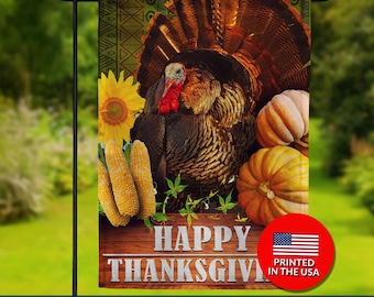 May include: Double-sided Thanksgiving garden flag featuring a detailed illustration of a turkey, pumpkins, corn, and a sunflower. The flag has the words "HAPPY THANKSGIVING" and "PRINTED IN THE USA".