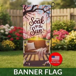 May include: A vertical banner flag featuring a porch swing with a pillow and blanket, under a tree with pink blossoms. The words "Soak up the Sun" are written in script. The flag is printed in the USA and is labeled "BANNER FLAG".
