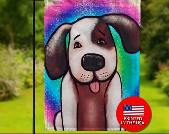 May include: A double-sided garden flag featuring a cartoon dog with a white and brown coat, set against a colorful rainbow background. The flag has the text "DOUBLE SIDED" at the bottom and a "PRINTED IN THE USA" logo.