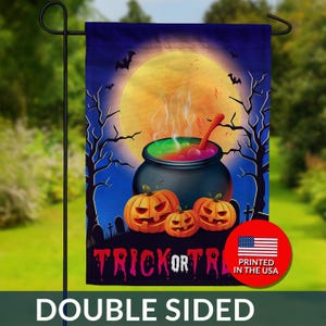 May include: Double-sided Halloween garden flag featuring a cauldron with bubbling potion, jack-o'-lanterns, and a full moon. The flag reads "Trick or Treat" in pink and purple. Includes a "Printed in the USA" emblem.