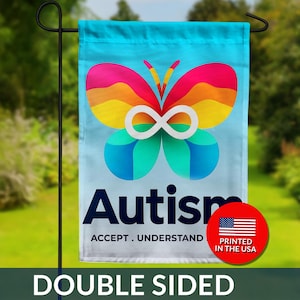 May include: A double-sided garden flag with a colorful butterfly design and the word "Autism". The flag has a light blue background and the text "ACCEPT. UNDERSTAND". A red circle with the American flag is in the corner.