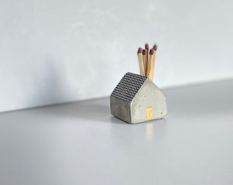 Match holder house grey concrete