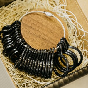 Black Ring sizer with sizes 4 to 13