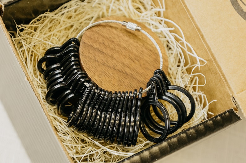 Black Ring sizer with sizes 4 to 13