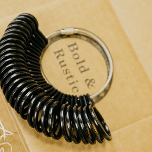 Black Ring sizer with sizes 4 to 13