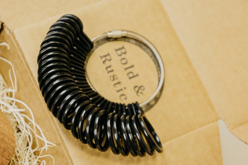Black Ring sizer with sizes 4 to 13