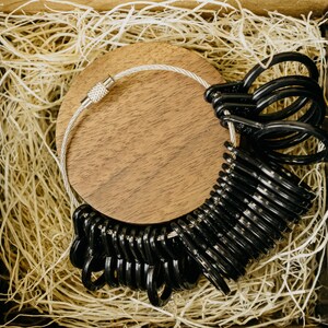 Black Ring sizer with sizes 4 to 13