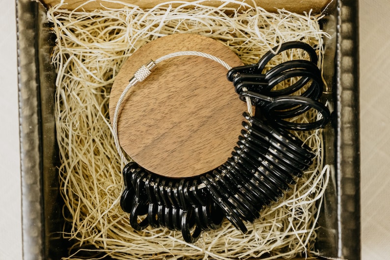 Black Ring sizer with sizes 4 to 13