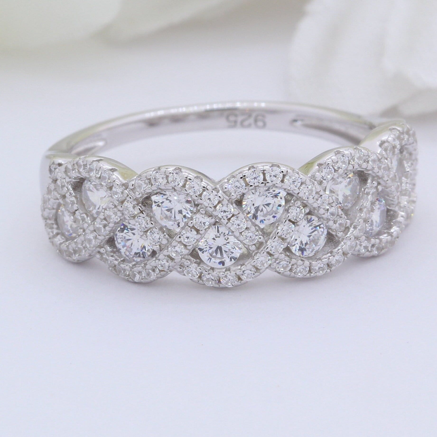 Braided diamond wedding band deals