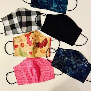 Two layer reversible 100% cotton face mask.
