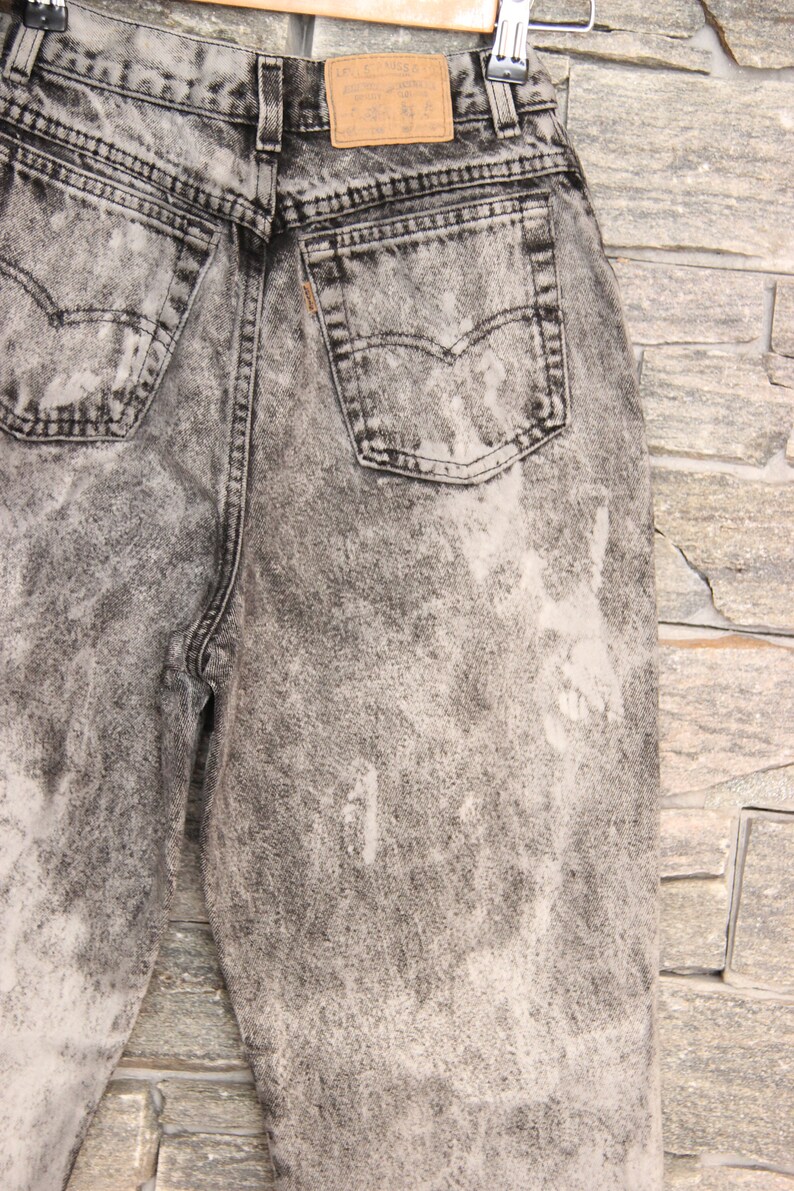black mom jeans with white stitching