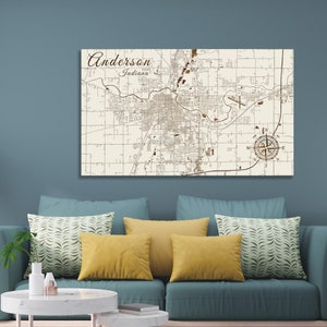 May include: A vintage-style map of Anderson, Indiana, printed on a wooden board. The map shows the city's streets and landmarks, with a compass rose in the lower right corner.