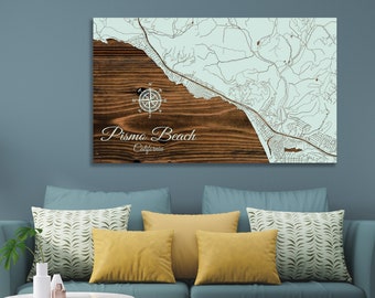 May include: A wooden map of Pismo Beach, California, with a compass rose and the text "Pismo Beach, California". The map is on a light blue background.