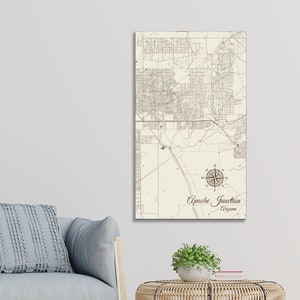 May include: A vintage-style map print of Apache Junction, Arizona. The map features a compass rose and detailed street lines. The text "Apache Junction, Arizona" is printed below the compass rose.