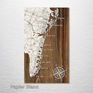 May include: A wooden map of the New Jersey coastline with the names of towns along the shore, including Cape May, Wildwood, Ocean City, and Atlantic City. A compass rose is in the lower right corner.