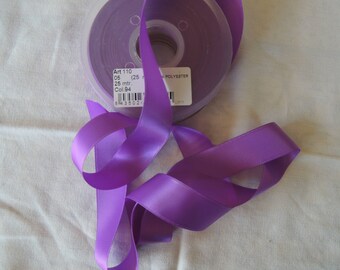 May include: A spool of purple satin ribbon with a label that reads "Art 110 05 (25 mtr. Col. 94) POLYESTER".