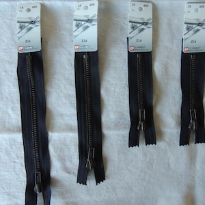 May include: Four black zipper closures with metal teeth and a silver pull. Each zipper is labeled with a white tag that reads "Z14" and has the measurements "18 460 cm" or "10 460 cm".
