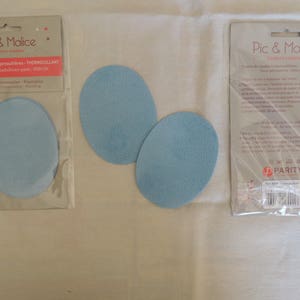 Peut inclure: Deux patchs thermocollants bleus pour réparer ou décorer les vêtements. L'emballage comprend des instructions d'utilisation et la marque "Pic & Malice".