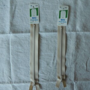 May include: Two white zipper pulls with metal sliders and Eclair Prestil labels. The labels have the text "20 410" and "15 410" on them.