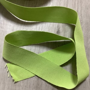 May include: A lime green ribbon with a ribbed texture.