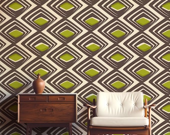 May include: A mid-century modern interior featuring a brown wooden dresser, a white armchair, and a patterned wallpaper. The wallpaper has a repeating geometric design in brown, cream, and green. A brown vase sits atop the dresser.