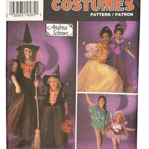 May include: A Simplicity Costumes sewing pattern envelope, number 8647, size AA (2-6). The front displays illustrations of children wearing various costumes, including a witch, a princess, and a fairy, against a purple background with text.