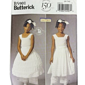 May include: Butterick sewing pattern B5901 for a white sleeveless dress with a square neckline and matching cropped trousers. The package features a 150th anniversary logo, size CL (6-7-8), and displays two variations of the outfit on the front cover.