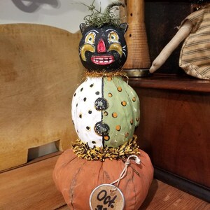 paper clay cat on pumpkin