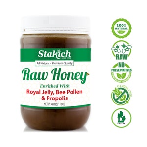 May include: A glass jar of Stakich Raw Honey, enriched with royal jelly, bee pollen, and propolis. The jar is labeled with a green and white label and has a net weight of 40 ounces (1134 grams). The jar is surrounded by green and white labels that say "100% Natural", "Raw", "No Preservatives", "Gluten Free", and "Pareve".