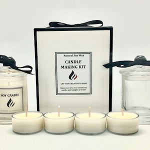 May include: A candle making kit with natural soy wax. The kit includes four small glass candle jars, two larger glass jars with lids, and a box with the text "Natural Soy Wax Candle Making Kit Let Your Creativity Shine Make your very own scented soy candles and tealights at home!"
