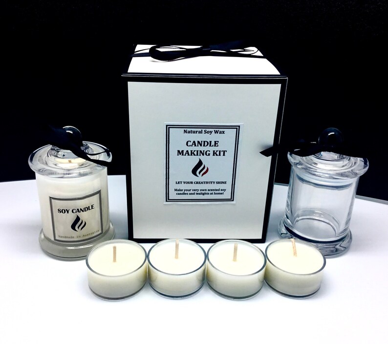 May include: A natural soy wax candle making kit with a white box, a glass jar with a lid, and four tea light candles. The box has the text "Natural Soy Wax Candle Making Kit" and "Let Your Creativity Shine".
