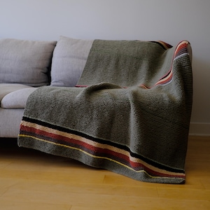 Hand Knitted Soft Blanket in Green with Colourful Accent Stripes