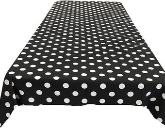 May include: Black and white polka dot tablecloth. The tablecloth is made of a soft, durable fabric and is perfect for any occasion.