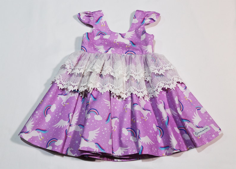 Exquisite Unicorn and rainbows on lilac background Dress