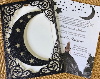 May include: Black and white invitation with a crescent moon and stars design. The text reads "Fuiste el regalo más hermoso que el cielo me concedió hoy como en ese momento sigo llena de dicha y felicidad aunque hoy dejas de ser una niña para convertirte en mujer para mi siempre serás mi niña amada Heidi Celeste Salazar Les hace una cordial invitación a la lebración de los XV años de su hija Anielka Salazar BRE 2023 Salón Broadway 6707 S Broadway Los Angeles 90003 Cuento con su valiosa presencia."