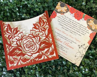 May include: A red and white laser-cut invitation with a floral design. The invitation is for a Quinceañera, a celebration of a girl's 15th birthday. The text on the invitation reads "Hey hace quince años mis padres daban gracias a Dios por mi. Hey day gracias a Dios por cuidarme y tenerme paciencia... Heriberto Bravo y Kenia Vázquez Se complacen en invitarlos a la celebración de los Quince Años de su hija Galilea Bravo fade 9 de Octubre del 2021 Satin Imperio Rd Naskatte F Diy yil Gate Fiata de 8:00 pm a 1:30 am"