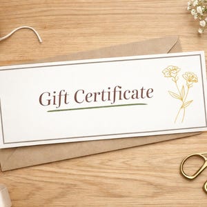 May include: A gift certificate on a brown envelope with the words "Gift Certificate" in a brown font. The certificate has a floral design and is on a wooden surface with scissors, ribbon, and twine.