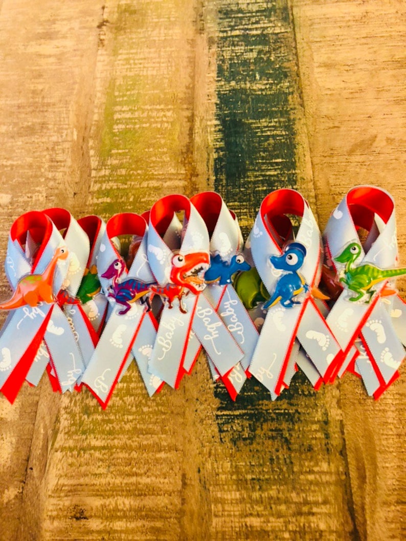 1 dad 1 mom and 17 guest Baby dino-themed baby shower pins