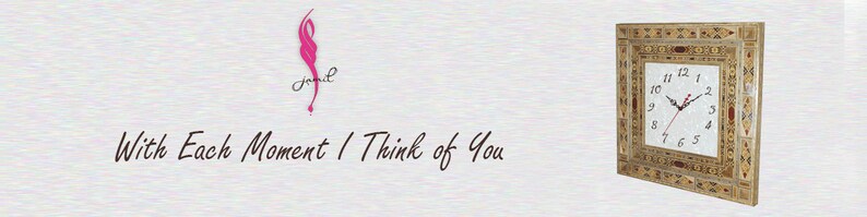 May include: A square clock with a white face and black hands. The clock is surrounded by a decorative frame made of wood and inlaid with mother of pearl. The clock is mounted on a white wall. The text "With Each Moment I Think of You" is written in black cursive on a white background.