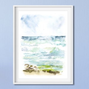 May include: Watercolor painting of a seascape with blue, green, and white waves crashing on a sandy beach. The sky is a light blue with white clouds.