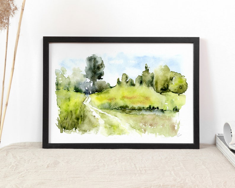 May include: Watercolor painting of a winding path through a green field with trees and a blue sky in the background.