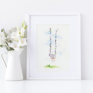 Pode incluir: Uma pintura em aquarela de uma menina em um balan&ccedil;o feito de flores. O balan&ccedil;o est&aacute; contra um c&eacute;u azul claro com nuvens brancas. A menina est&aacute; vestindo uma camisa roxa e uma saia branca.