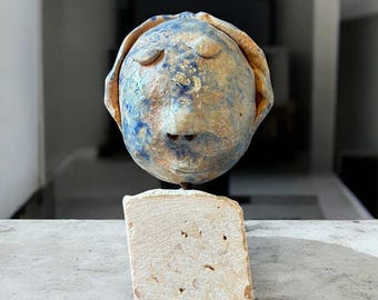 Ceramic Sculpture Head on Stone