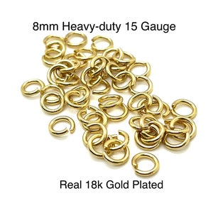 May include: A pile of gold-plated jump rings, 8mm in size, with a heavy-duty 15 gauge. The text on the image reads "Real 18k Gold Plated". These open rings are used for jewelry making and other crafts.
